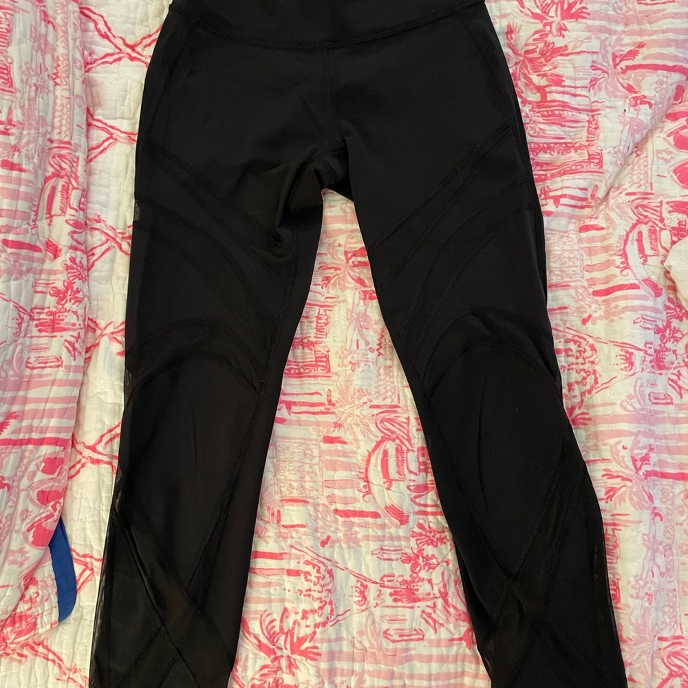 Lululemon black leggings with netting.  Size 6.  Excellent condition.